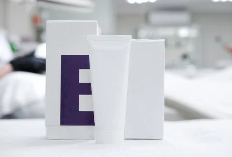 Cosmetics with vitamin E are on the table against the backdrop of the cosme.. Stock Photos