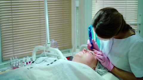Cosmetologist Applying Permanent Make Up on Eyebrows Stock Footage 136176477