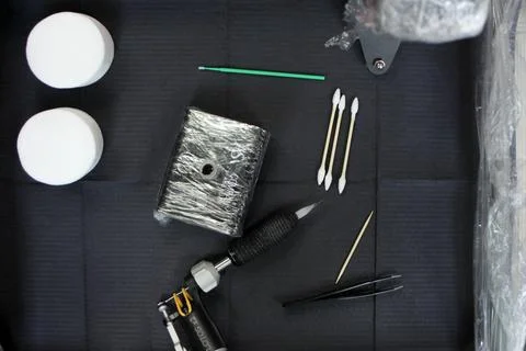 Cosmetologist applying permanent make up eyebrows for a client in a salon Stock Photos