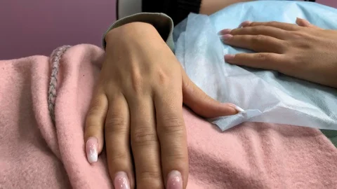 Cosmetologist applying permanent makeup on lips. Cosmetology procedure. Applying Video stock 119892286