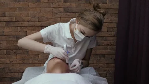 Cosmetologist cleaning face Stock Footage 175183004