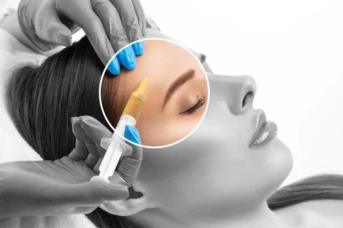 Cosmetologist does injections for lips augmentation and anti wrinkle inject.. Stock Photos