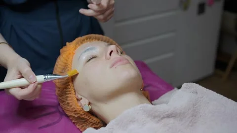 A cosmetologist makes multiple biorevitalization injections to a woman's face Stock Footage 291727097
