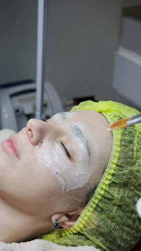 A cosmetologist makes multiple biorevitalization injections to a woman's face Stock Footage 293250366