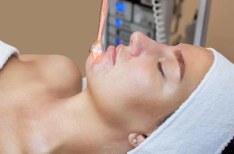 The cosmetologist makes the procedure Microcurrent therapy Stock Photos