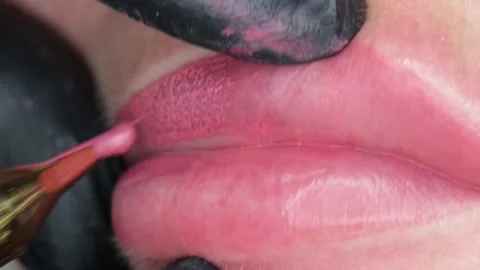 Cosmetologist making lips microblading permanent procedure using tattoo machine Stock Footage 142289223