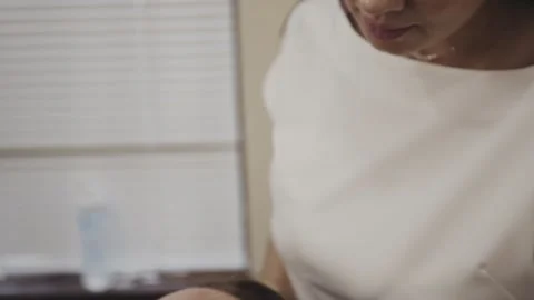 Cosmetologist performing listing operation with device on female patient face Stock-Footage 149023926