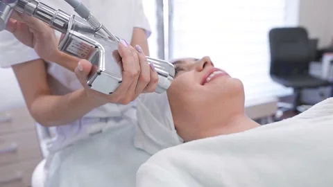 The cosmetologist performs the procedure on the skin Stock Footage 146456247
