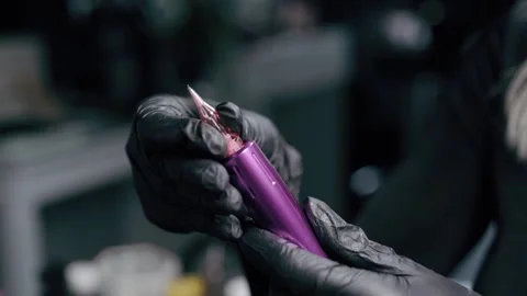 Cosmetologist preparing ink machine. Stock Footage 229461937