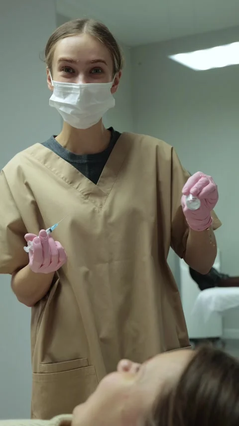 Cosmetologist ready with syringe for injection. Stock Footage 330531454