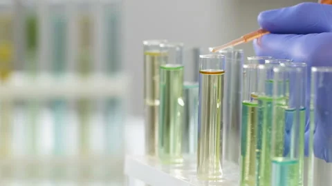 Cosmetology center worker adding essential oil to create concentrate agent Stock Footage 88516718