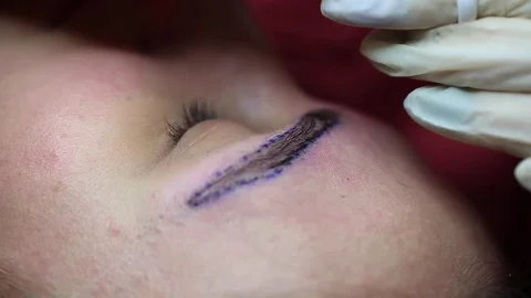 Cosmetology procedure: Eyebrows Microblading black paint Stock Footage 75369982
