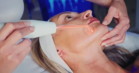 Cosmetology Procedure Using Advanced Facial Device in Spa Stock Footage 323613848