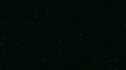 Cosmic dust particles falling against a deep black background Stock Footage 342115389