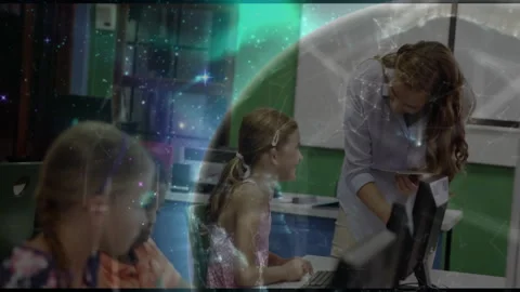 Cosmic overlay swirling over computer lab revealing teacher guiding student Stock Footage 311505480