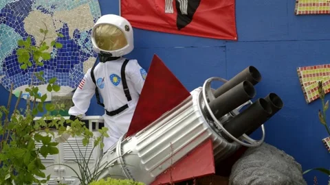 Cosmonaut as decorative elements in landscape design on spring festival RHS Stock Footage 144979795