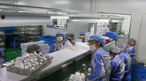 Cosmotic creams on assembly line and busy working people Stock Footage 44761397