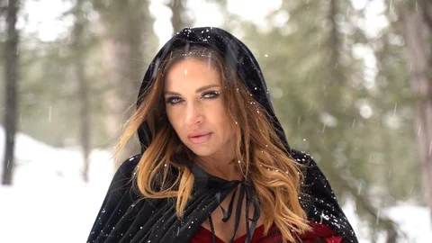 Cosplay model portrait in a winter forest, medieval costume, heavy snowfall Stock Footage 125797027