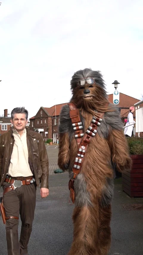 Cosplayer dressed as Han Solo and Chewbacca at a UK Comic Con Stock Footage 333274853
