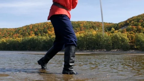 Cossack dance with sword on river. Sand island with forest Stock Footage 119767141