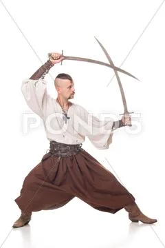Cossack in trousers on white background with sabers Stock Photos