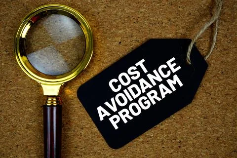 Cost Avoidance Program text on price tag with magnifying glass on cork boar.. Fotos de archivo