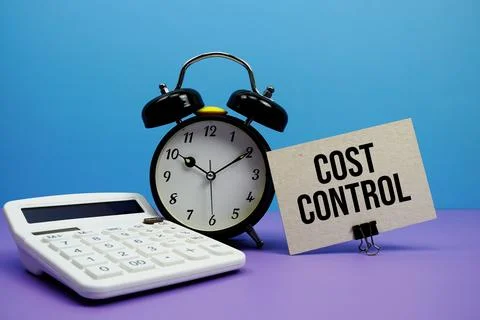 Cost Control text with calculator and alarm clock on blue and purple backgrou Stock Photos