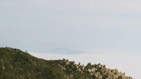 Costal mountain range rolling clouds over the ocean 4k 24fps Stock Footage 132867653