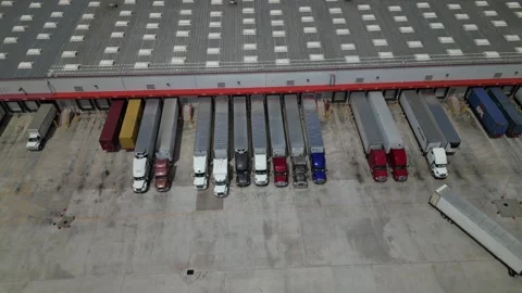 Costco distribution center. trucks loading and unloading in warehouse Stock Footage 241951409