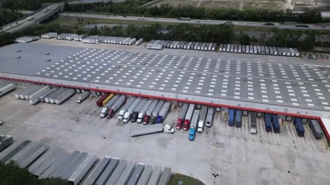 Costco distribution center. trucks loading and unloading in warehouse Stock Footage 241951476