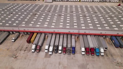Costco distribution center. trucks loading and unloading in warehouse Stock Footage 241951479
