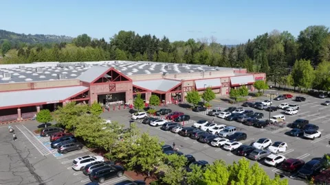 Costco warehouse store with large packed parking lot, red-trimmed entrance Stock-Footage 337052848