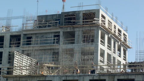 COSTRUCTION SITE MANY WORKERS CRANE Stock Footage 105934540