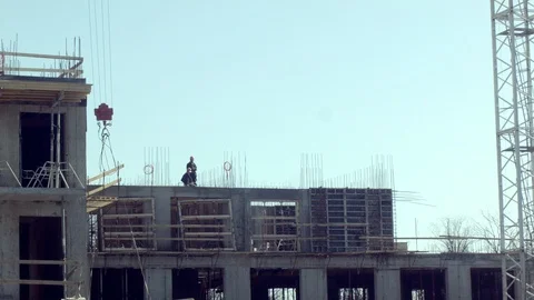 COSTRUCTION SITE WORKERS CRANE Stock Footage 105934579