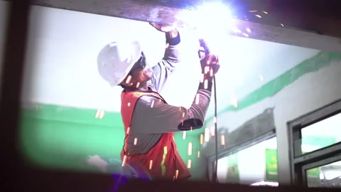 Costruction worker and welding machine with sparks and flashes. Stock Footage 138323578