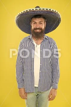 Costume accesory. Bearded man in mexican hat. Mexican man wearing sombrero Stock Photos