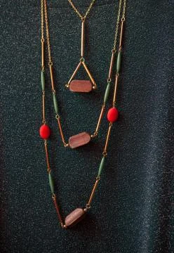 Costume jewelry made of wood against the guipure Stock Photos