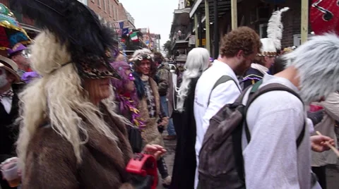 Costumed crowd moving down Mardi Gras street Stock Footage 52372710