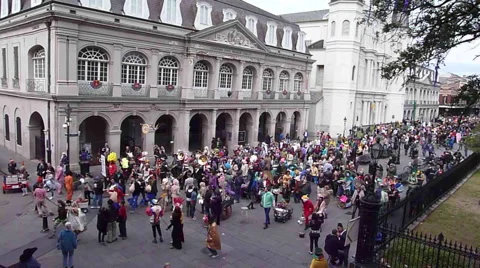 Costumed crowd moving down street during Mardi Gras Stock Footage 52372818