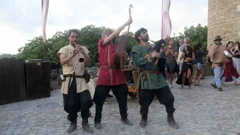 Costumed Medieval Musicians Playing Outside Óbidos Castle in Portugal Vidéo 340979997