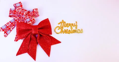 Cosy Christmas background featuring a soft red knitted bow Stock Photos