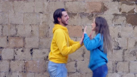 Cosy couple dances in front of the camera with synchronism and coordination Stock Footage 153447291