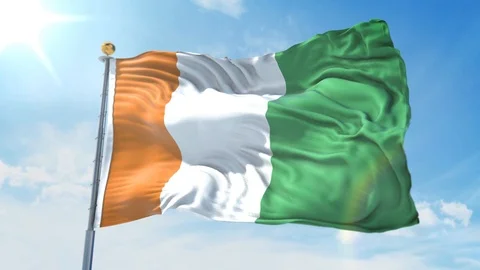 Cote D'Ivoire flag waving in the wind against deep blue sky. National theme. Stock Footage 123982337