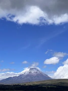 Cotopaxi Volcano with Snow Covered Summit and Blue Sky Stock Photos