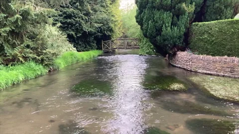 Cotswolds River under footbridge Stock Footage 275657183