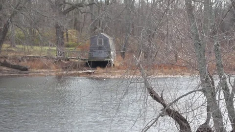 Cottage across river at Concord Stock Footage 73748813
