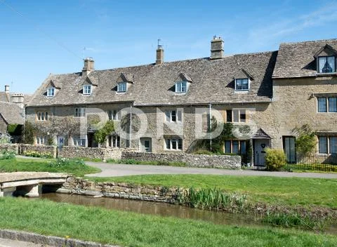 Cottage and stream Stock Photos