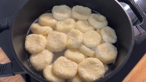 Cottage Cheese Dumplings Boiling in Pot, Close-Up Food Preparation Stock Footage 344602205