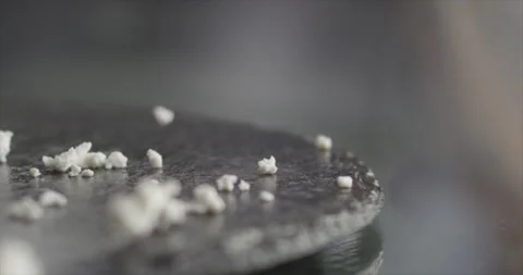 Cottage cheese falls on a black surface Stock Footage 197870587