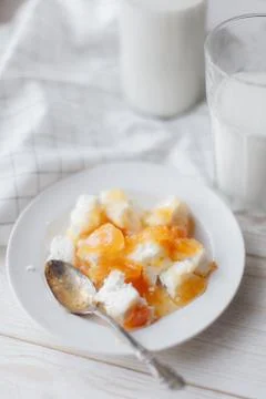 Cottage cheese with peach jam Stock Photos